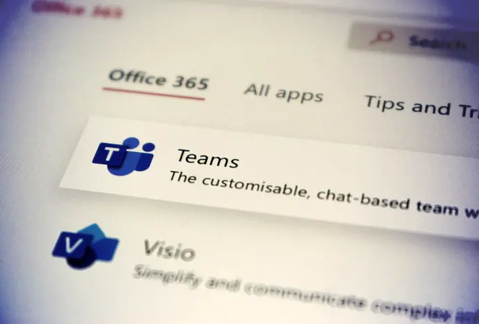 a close up of a computer screen with some stickers on it